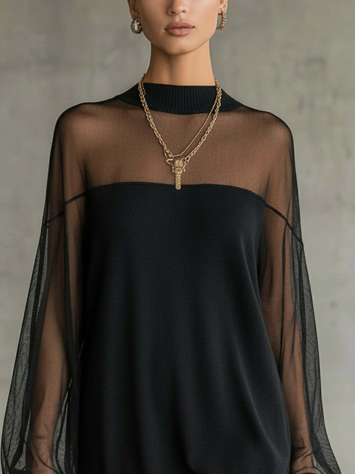 Amélie | Elegante minivestido negro con mangas de malla